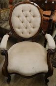 A Victorian rosewood open armchair