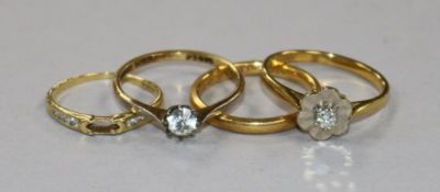 A 22ct gold wedding band and three other 18ct gold rings including diamond set.