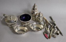 A group of silver including a three piece condiment set, London, 1962, sterling dishes, bookmark and