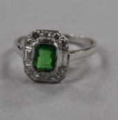 An 18ct white gold, green garnet? and diamond cluster ring, size N.