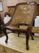 A mid Victorian mahogany caned spoonback chair (a.f.)
