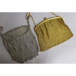A gold plated purse and a white metal mesh purse.