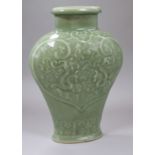 A Chinese celadon glazed vase height 18cm