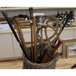 A collection of walking sticks in a wicker basket