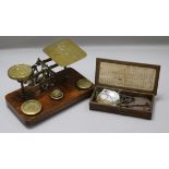 A set of postal scales and a set of apothecary scales