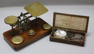 A set of postal scales and a set of apothecary scales