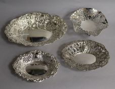 A late Victorian repousse silver bonbon dish, London, 1892 and three other bonbon dishes.
