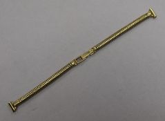 An 18ct gold watch bracelet, length 16cm.