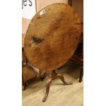 An oak tilt top tripod table W.84cm