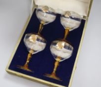 A set of four 1937 Coronation champagne coupes, in Mappin & Webb case, the glasses inscribed in gilt