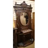 A mirrored walnut hall stand W.114cm