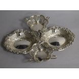 A pair of George V pierced silver tyg dishes and a pair of silver bonbon dishes, 9 oz.