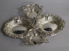 A pair of George V pierced silver tyg dishes and a pair of silver bonbon dishes, 9 oz.