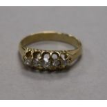 A yellow metal and graduated five stone diamond ring, size K.