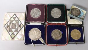 A mother of pearl and white metal-inlaid card case, an 1890 American silver dollar, sundry medals,