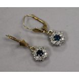 A pair of 9ct gold, sapphire and diamond cluster earrings.