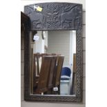 An African carved wood mirror W.45cm