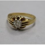 A 1960's 18ct gold and claw set solitaire diamond ring, size S.