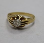 A 1960's 18ct gold and claw set solitaire diamond ring, size S.