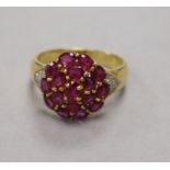 A 14ct gold and gem set cluster dress ring, size N/O.