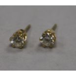 A pair of 18ct gold and solitaire diamond ear studs.