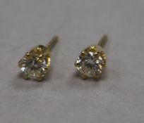 A pair of 18ct gold and solitaire diamond ear studs.