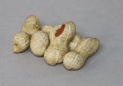 A Japanese Meiji period carved ivory group of peanuts, 5.5cm