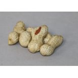 A Japanese Meiji period carved ivory group of peanuts, 5.5cm