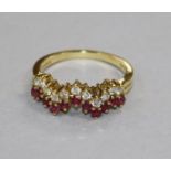 A modern 18ct gold, ruby and diamond half hoop 'zigzag' ring, size N.