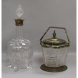 A silver mounted glass decanter and stopper and a biscuit barrel. height 31cm