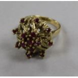 A 14ct gold and ruby set cocktail ring, size M.