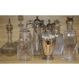 A collection of decanters and claret jugs