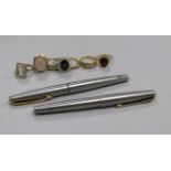 Two Parker pens with 14ct gold nibs and seven assorted gem set rings, including 9ct and 18ct.
