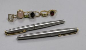 Two Parker pens with 14ct gold nibs and seven assorted gem set rings, including 9ct and 18ct.