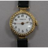 A lady's 18ct gold and split pearl set manual wind wrist watch, retailed by Tiffany & Co.