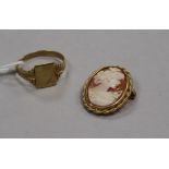 A 9ct gold signet ring and a cameo brooch in 9ct gold mount.