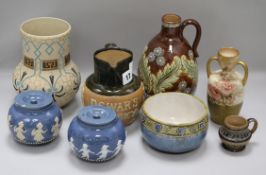 Two Doulton whisky jugs and six Lambeth Doulton pots