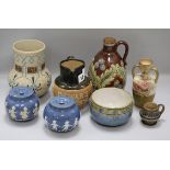 Two Doulton whisky jugs and six Lambeth Doulton pots