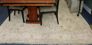 An ivory ground carpet 285 x 245cm