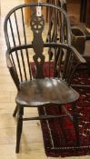 A Victorian ash and elm Windsor wheelback armchair