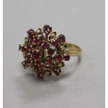 A 14ct ruby and diamond cluster dress ring, size N.