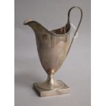 A George III silver helmet shaped cream jug, Peter & Ann Bateman? London, 1791, base filled? 15.
