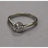 An 18ct white gold, platinum and solitaire diamond ring, size L.