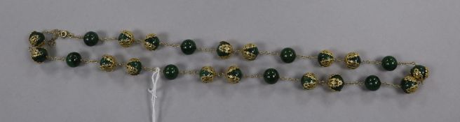 A yellow metal mounted nephrite? jade bead necklace, 62cm.