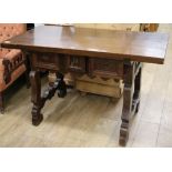 A Spanish walnut side table W.134cm