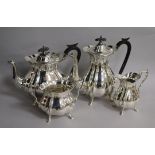 A 1920's silver four piece tea set by Walker & Hall, gross 61 oz.