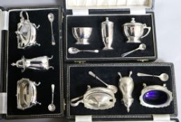 Three assorted cased three piece silver condiment sets.