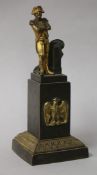 A French bronze miniature figure of Napoleon, on rectangular plinth with Imperial Eagle emblem,