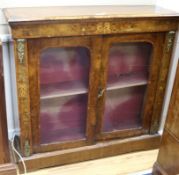 A walnut inlaid cabinet W.113cm