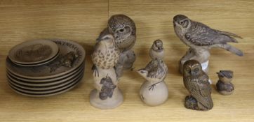 A collection of Poole pottery bird related models and plates and a Ken Norris resin owl